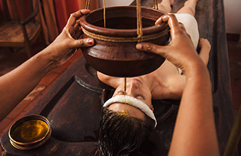 Takradhara Ayurvedic therapy with buttermilk